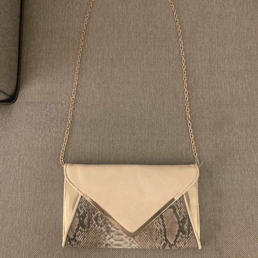 Snake skin cream colored clutch